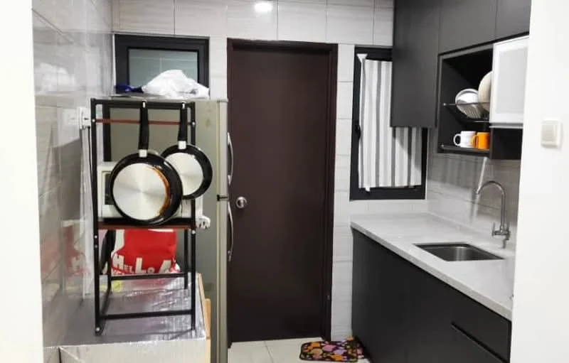 Kitchen features: grey cabinetry, white countertop, stainless-steel sink, chrome faucet, built-in microwave, refrigerator, open shelving, wall-mounted window with sheer curtains, tile backsplash, floor tiles, colorful area rug; style: modern.