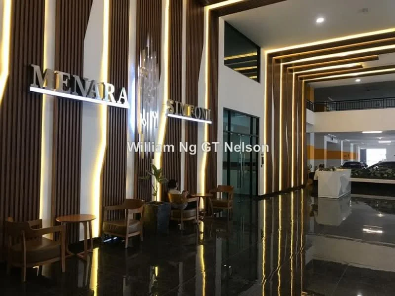 Room features: wood paneling on walls, black polished tile flooring, recessed LED lighting, feature wall with backlit signage, modern seating with wooden chairs, open lobby space, high ceiling, decorative light fixture; style: modern.