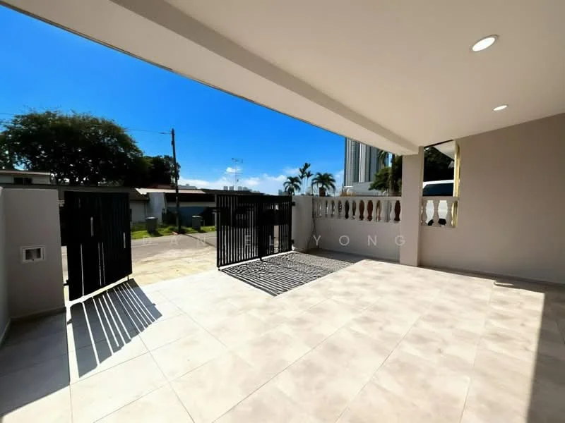 Exterior features: paved flooring, metal gate, fenced perimeter, outdoor space, sunny weather, clear blue sky, surrounding greenery; style: modern.