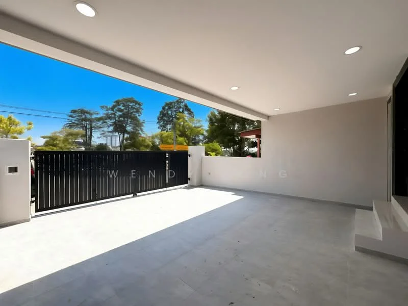 Exterior features: open patio area, grey tiled flooring, black metal gate, white walls, recessed ceiling lights, surrounding greenery, clear blue sky; style: modern.