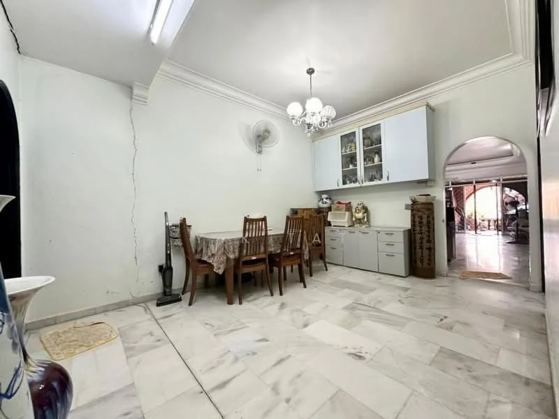 Dining features: marble tile flooring, white painted walls, tray ceiling with chandelier, dining table with four wooden chairs, wall-mounted ceiling fan, built-in cabinetry with glass doors, decorative vase on table, arched doorway leading to another room; style: traditional.