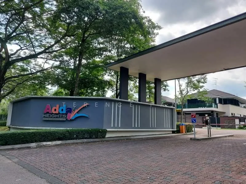 Exterior type: gated community; features: modern entrance gate, landscaped greenery, paved driveway, signage with 'Adda Heights', surrounding trees, security access, visible parking area; style: contemporary.