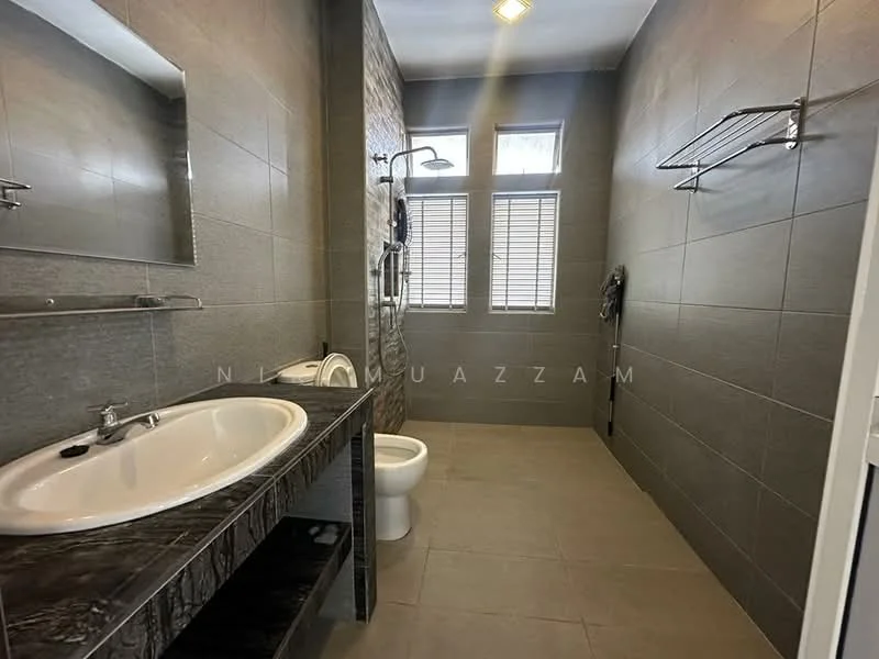 Bathroom features: single-sink vanity with dark stone countertop, chrome basin mixer faucet, framed mirror above vanity, one-piece toilet, walk-in shower with glass enclosure, rain shower head, handheld shower, grey ceramic tile flooring, grey tiled walls, window with horizontal blinds, towel rack, shower niche; style: modern.