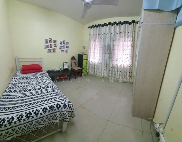 Bedroom features: single bed with patterned bedding, ceiling fan, light yellow painted walls, tile flooring, two windows with sheer curtains, wooden wardrobe, green dresser, photo wall with multiple frames, decorative wall art.
