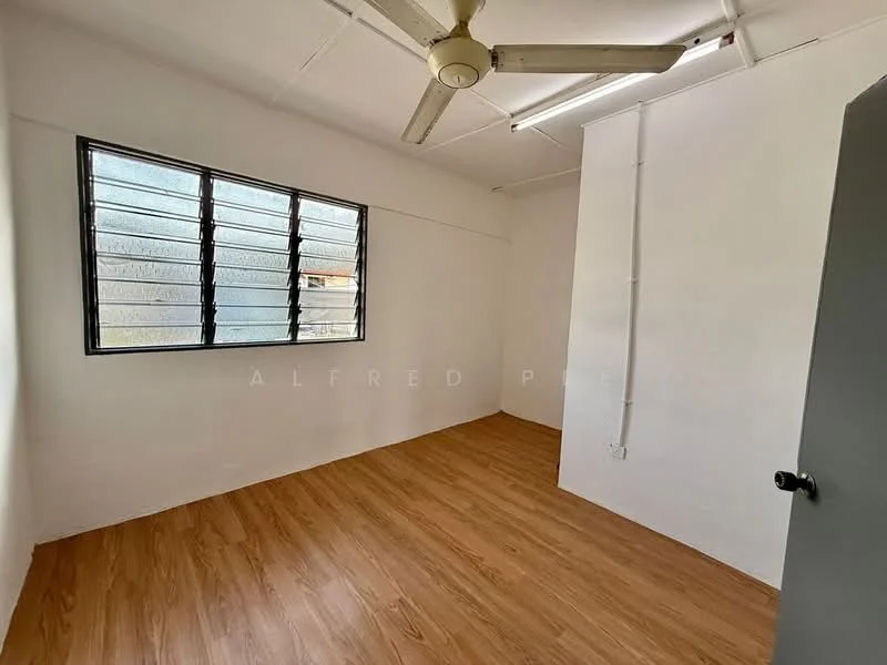 Room features: white painted walls, vinyl plank flooring, ceiling fan, large window with metal grille, neutral decor, no visible furniture; style: minimalist.