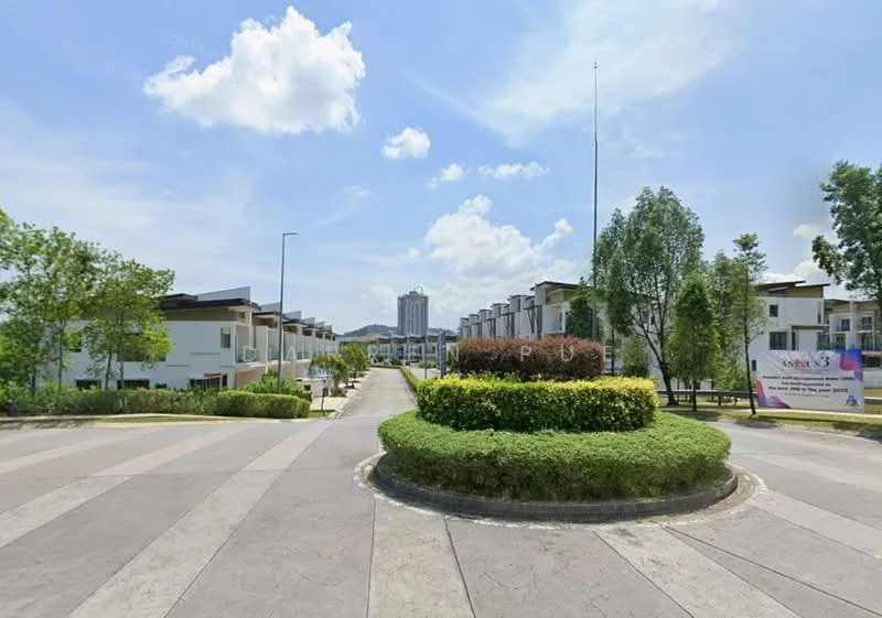 Exterior type: linked terrace house; features: manicured lawn, mature trees, paved walkway, landscaped garden with shrubs, multi-storey buildings in background, open road leading into the development, street lighting, signage for the development; style: modern.
