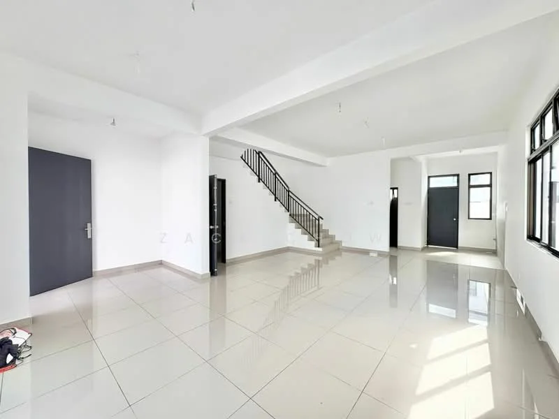 Room features: white painted walls, polished ceramic tile flooring, exposed ceiling with pendant lights, staircase with metal railing, large windows for natural light, double-door entrance, black refrigerator, open layout, corner space for furniture arrangement; style: modern.