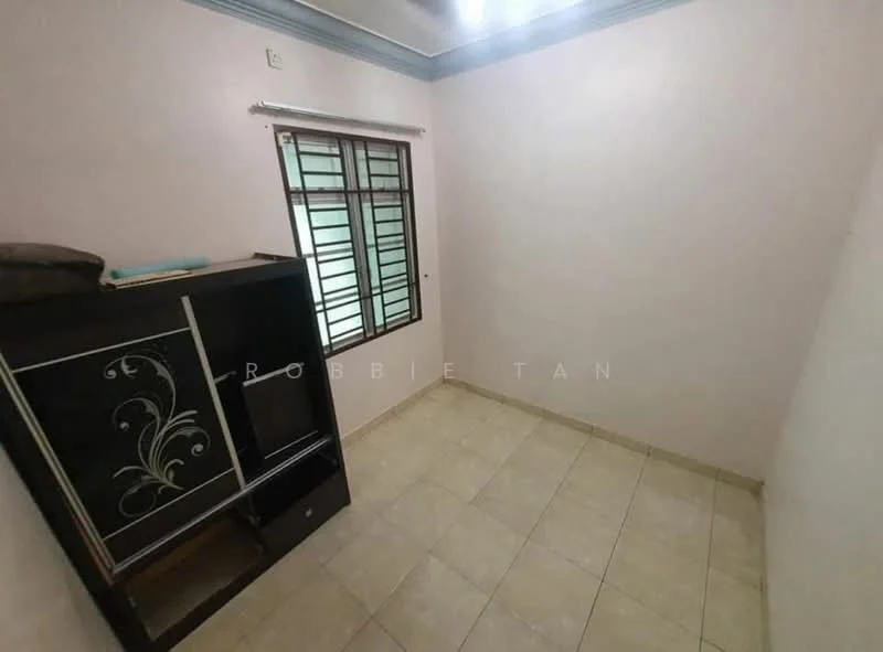 Room features: light-colored painted walls, tile flooring, window with metal grille, built-in cabinet with decorative design, ceiling with light fixture, neutral color scheme.