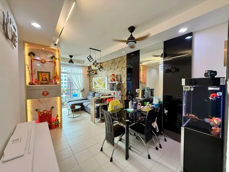 Living features: grey accent wall, white painted walls, tile flooring, 5-blade ceiling fan with light, sofa in light grey, coffee table, TV console, wall-mounted TV, decorative shelving unit, large window with sheer curtains, decorative plants, dining table with black chairs, aquarium, artwork on wall; style: modern; view: city. Room features: white cabinetry, kitchen appliances visible, decorative items on shelves.