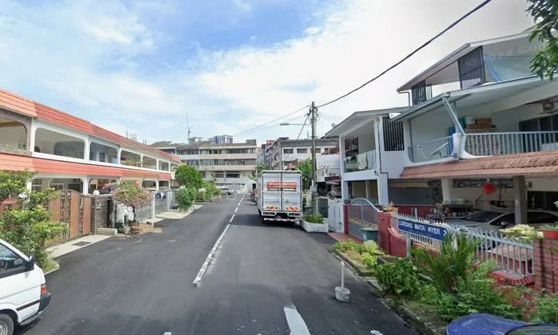 Exterior type: linked terrace house; features: two-storey buildings, red brick facade, white painted facade, balconies on upper floors, manicured landscaping, paved road, street view with parked vehicles, utility truck on street, surrounding greenery; style: traditional.