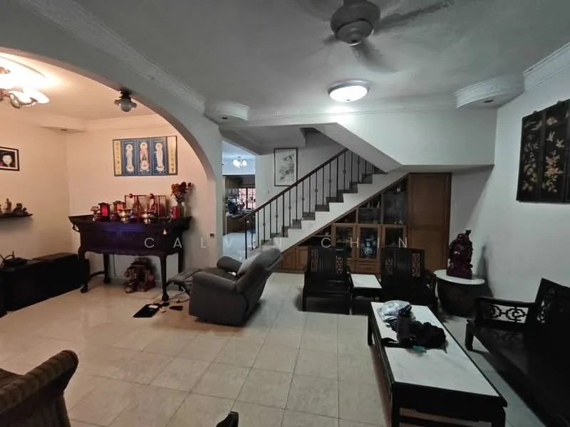 Living features: cream painted walls, white ceiling with crown moulding, tile flooring, 5-blade ceiling fan, recessed ceiling lights, sofa in grey fabric, wooden coffee table, wooden side tables, decorative wall art, staircase with wooden railing, built-in wooden cabinet, decorative figurines; style: traditional.