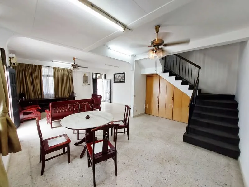 Living features: ceiling fan with light, dining table with round top, 4 wooden dining chairs, sofa set in red upholstery, large windows with curtains, light-colored walls, tile flooring, staircase leading to upper floor, wooden cabinets, decorative wall art; style: modern.