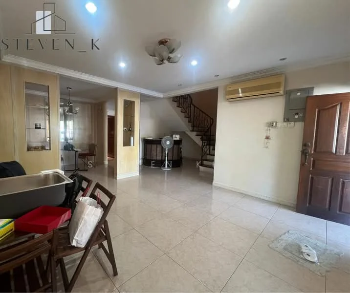 Living features: cream painted walls, marble tile flooring, tray ceiling with ceiling fan, wall-mounted split AC, wooden front door, staircase leading to upper floor, large windows for natural light, decorative wall paneling, open layout, area rug, dining table with chairs, standing fan; style: modern.