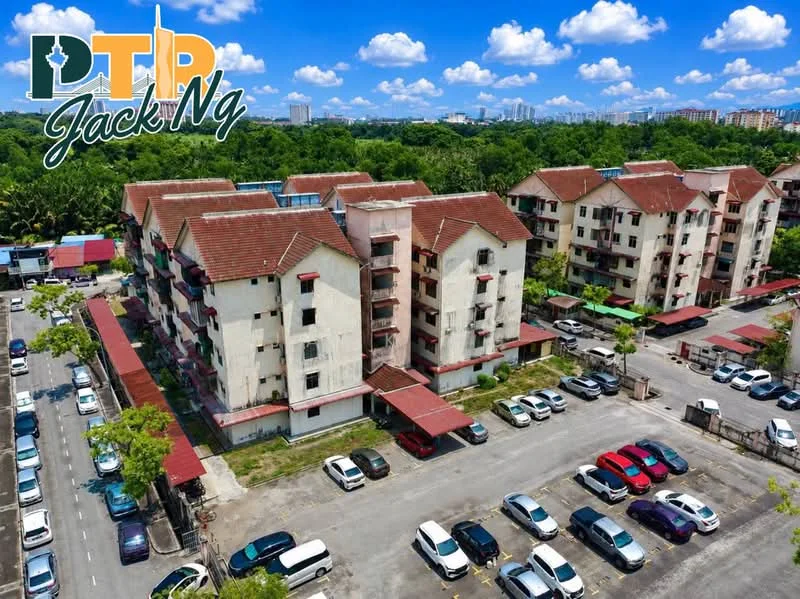 Exterior type: low-rise apartment block; features: red tile roof, white painted facade, multiple balconies, parking lot with visible cars, surrounded by greenery, two-storey building, manicured landscaping; style: modern.
