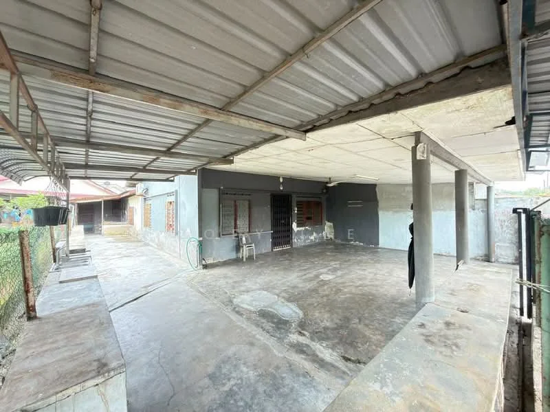 Exterior features: covered patio area, concrete flooring, metal roof, exposed concrete walls, fenced perimeter, open space, outdoor area with potential for landscaping; style: minimalist.