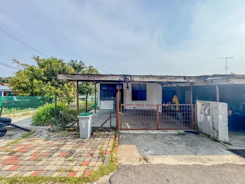 Exterior type: detached bungalow; features: single-storey, metal roof, concrete facade, front porch with railing, paved walkway, manicured lawn, fenced yard, driveway, garden area, visible utility pole, outdoor storage area; style: traditional.