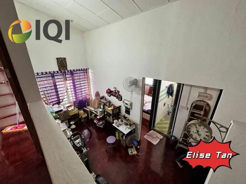 Room features: wooden flooring, white painted walls, purple curtains, ceiling fan, shelves with various items, table with chairs, wall clock, doorway leading to another room, decorative items on shelves, bed visible through doorway.
