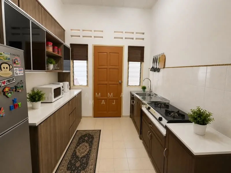 Kitchen features: white quartz countertop, wood cabinetry with brown finish, stainless-steel fridge, built-in microwave, freestanding gas stove with 4 burners, stainless-steel sink, chrome pull-down faucet, tile backsplash, cream tiled flooring, window with wooden blinds, decorative plants, area rug with intricate pattern; style: modern.