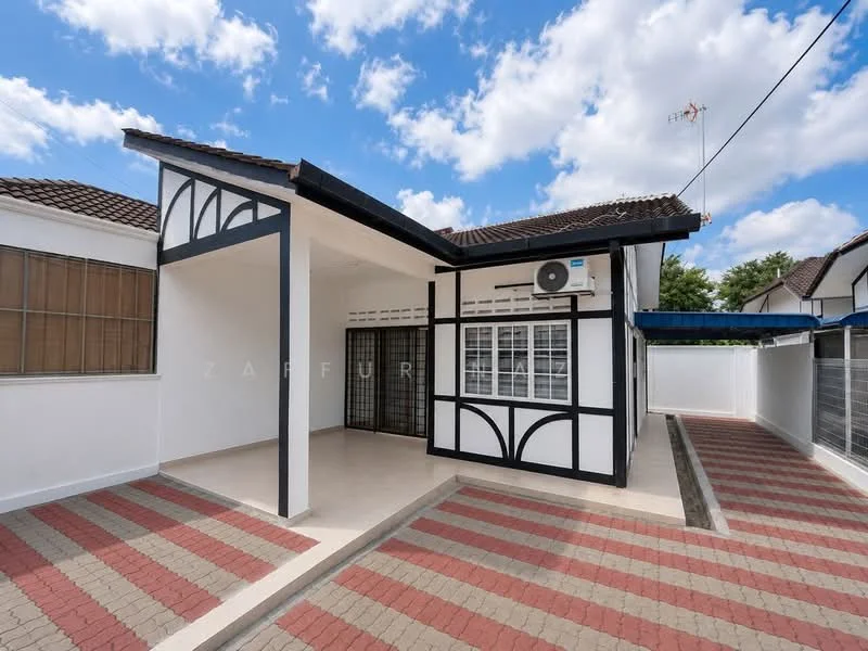 Exterior type: detached bungalow; features: white painted facade, black timber accents, pitched tile roof, manicured lawn, paved driveway, air conditioning unit, front porch, large windows, security grille, surrounded by greenery; style: modern.