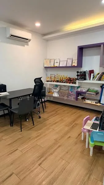 Study features: wooden flooring, 1 wall-mounted split AC, white painted walls, recessed LED downlights, black office desk, black ergonomic office chair, bookshelf with multiple compartments, decorative trophies, colorful children's table and chairs, laptop on desk, certificates displayed on wall; style: modern.