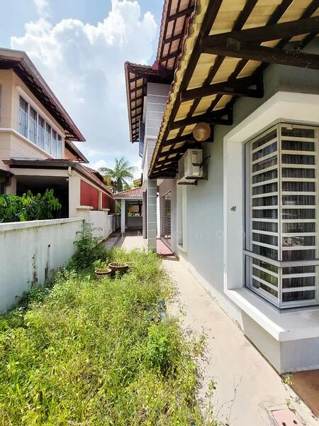 Exterior type: detached bungalow; features: two-storey building, white painted facade, brown tiled roof, exposed wooden beams, side garden with overgrown grass, windows with metal grilles, air conditioning unit on wall, pathway leading to entrance; style: modern.