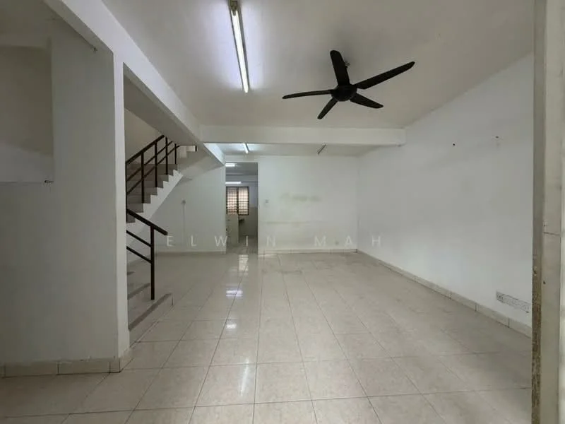 Room features: white painted walls, glossy tile flooring, 5-blade ceiling fan, staircase with wooden railing, fluorescent lighting, large window for natural light, open layout, no visible furniture; style: minimalist.