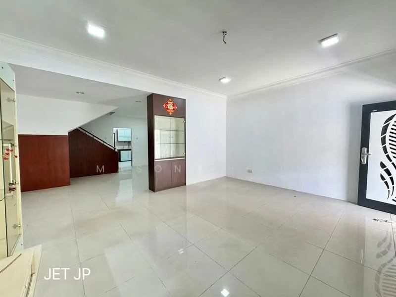 Room features: white painted walls, glossy white tile flooring, recessed LED downlights, open layout, wooden staircase visible in background, glass display cabinet, decorative wall panel, main entrance door with intricate design; style: modern.