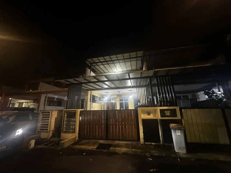 Exterior type: linked terrace house; features: metal roofing, open car porch, double-volume main entrance, black painted facade, cream painted walls, security gate, outdoor ceiling fan, front garden area, driveway with interlocking pavers; style: modern.