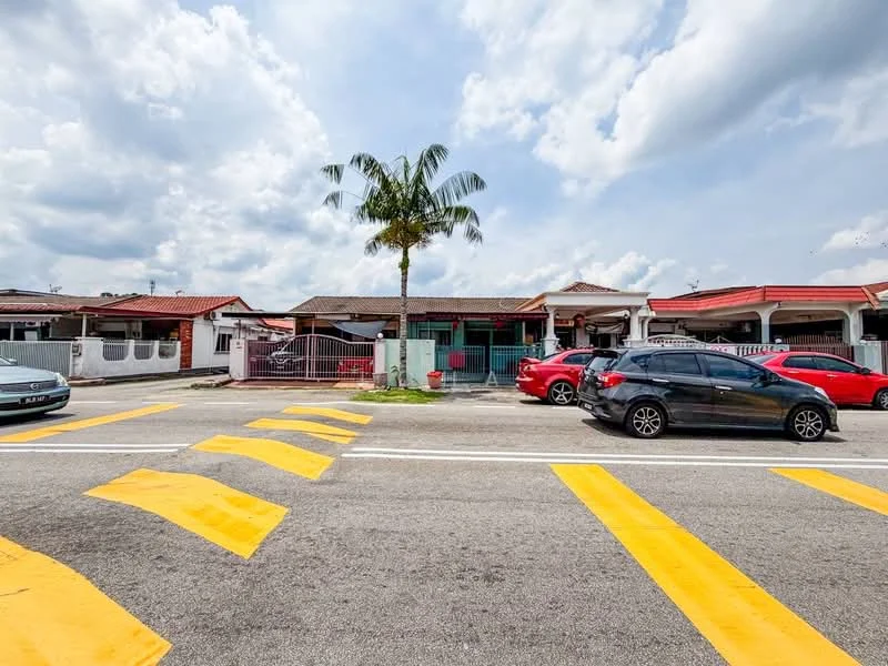 Exterior type: linked terrace house; features: red tiled roof, white painted facade, palm tree in front yard, driveway with interlocking pavers, front gate, manicured lawn, multiple parked cars, street view with yellow pedestrian crossing; style: modern.