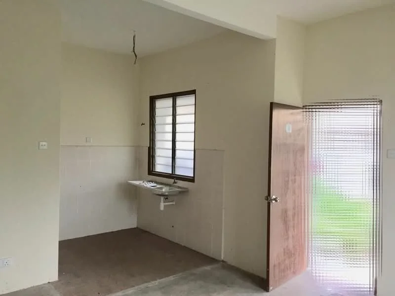 Room features: plain beige walls, concrete flooring, single window with horizontal bars, sink with wall-mounted faucet, door leading outside, light fixture hanging from ceiling, no visible cabinetry, no visible appliances; style: minimalist; view: garden.