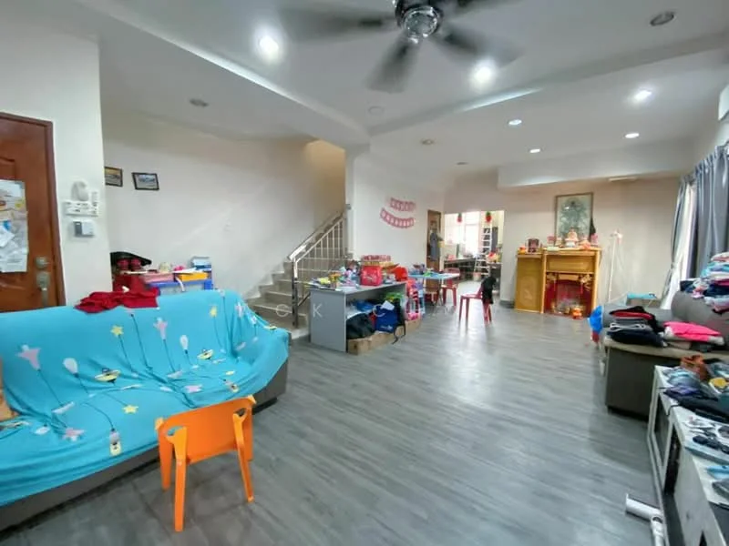 Living features: laminate flooring, white painted walls, ceiling fan, sofa with blue throw blanket, coffee table, TV console, decorative items on shelves, staircase leading to upper floor, various children's toys, brightly colored chairs, window with curtains; style: modern.