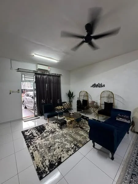 Living features: 5-blade ceiling fan with light, wall-mounted split AC, white painted walls, glossy white tile flooring, black fabric sofa, blue velvet sofa, round coffee table, area rug with abstract pattern, two rattan chairs, decorative wall art, curtains, potted plant; style: modern.