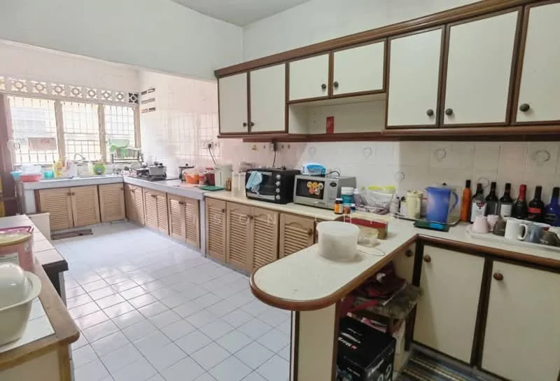 Kitchen features: white tiled flooring, white walls, wood cabinetry with louvered doors, countertop with breakfast bar, double-bowl stainless-steel sink, chrome pull-down faucet, built-in microwave, freestanding range oven, toaster, blender, various kitchen utensils, wine bottles on display, multiple storage cabinets, window with metal grille, natural light from window; style: traditional.