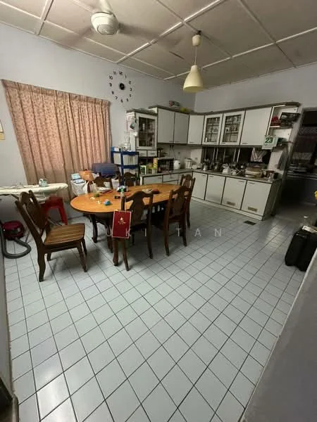 Kitchen features: white painted walls, tile flooring in light blue, ceiling with fluorescent lights, wooden dining table with 6 chairs, curtains in floral pattern, built-in cabinets with glass doors, countertop with storage underneath, microwave on countertop, kettle on countertop, sink with faucet, refrigerator visible, vacuum cleaner in corner, clock on wall, open shelving for storage; style: traditional.