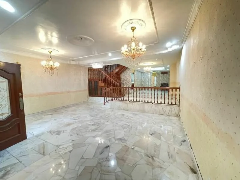 Room features: marble flooring, cream painted walls, crown moulding, chandeliers, wooden staircase, wood railing, recessed lighting, high ceiling; style: luxury.
