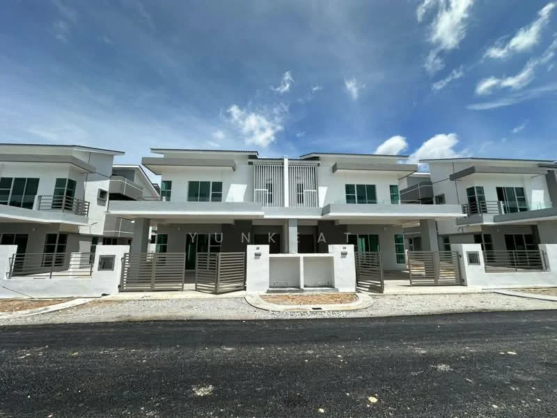 Exterior type: linked terrace house; features: white painted facade, glass windows, metal railings, flat roof, two-storey structure, manicured landscaping, paved driveway, front porch area, gated entry, surrounded by open space; style: modern.