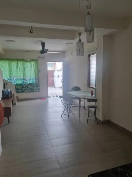 Room features: light-colored walls, tile flooring, ceiling fan, hanging pendant lights, dining table with chairs, green patterned curtain, window with blinds, open layout, visible entrance to outdoor area; style: modern; view: garden.