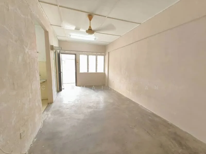 Room features: plain beige painted walls, concrete flooring, ceiling fan, large windows, natural light, open layout, no visible furniture, unfinished appearance; style: minimalist.