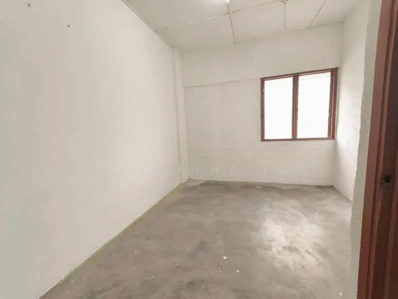 Room features: white painted walls, concrete flooring, single window, no visible furnishings, plain ceiling, no visible lighting fixtures; style: minimalist.
