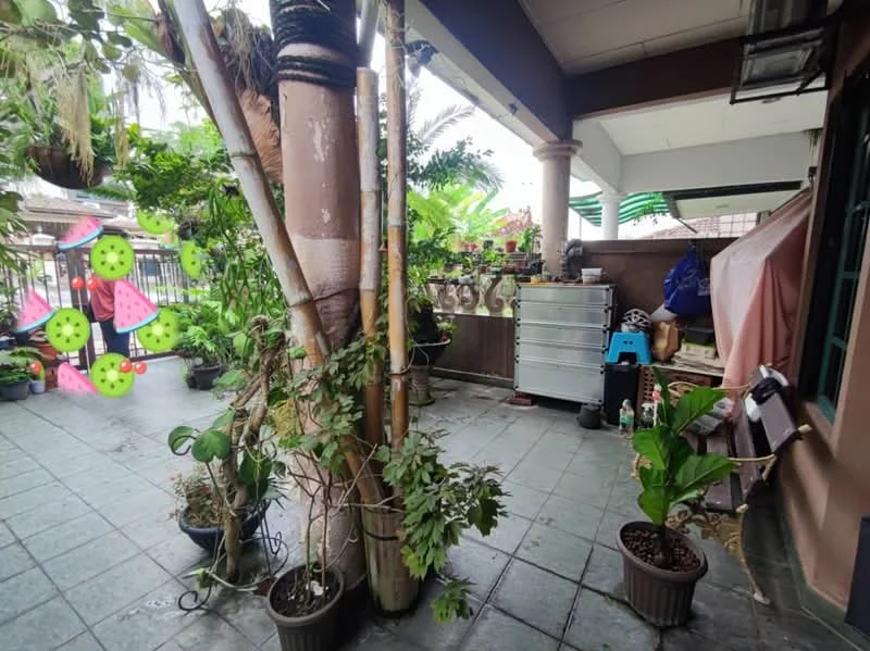 Room features: tiled flooring, greenery with potted plants, decorative wall with watermelon motifs, wooden pillars, bamboo plants, storage cabinet, covered area with tarpaulin, outdoor seating area; style: tropical; view: garden.