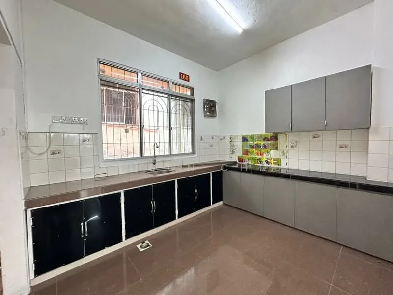 Kitchen features: single-bowl stainless-steel sink, chrome faucet, black lower cabinets, grey upper cabinets, white tiled backsplash, green and yellow patterned wall tiles, dark countertop, window with metal grille, wall-mounted electrical outlets, flooring with glossy finish; style: modern.