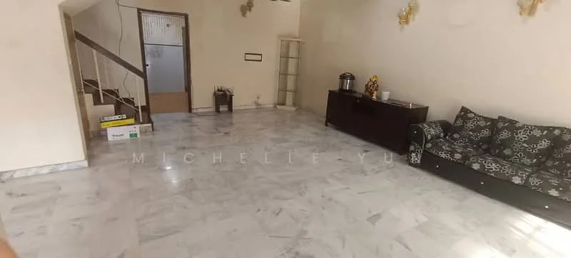 Living features: marble flooring, white painted walls, ceiling fan, 3-seater sofa with black upholstery and floral pattern, wooden sideboard, decorative wall sconces, open space layout, staircase leading to upper floor, glass display cabinet, natural light from windows; style: modern.