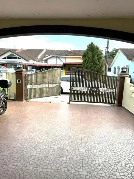 Exterior type: linked terrace house; features: gated entrance, paved driveway, decorative metal gate, front yard with landscaping, surrounded by residential houses, single-storey, car parked in driveway; style: modern.