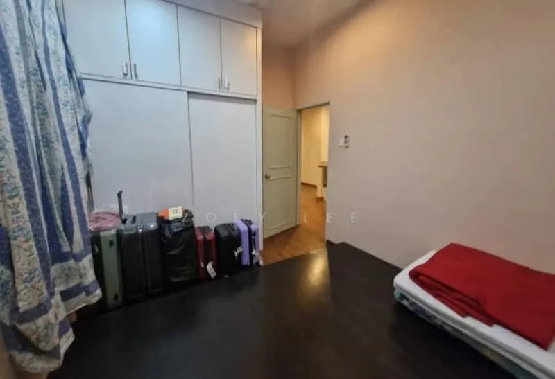 Bedroom features: light pink painted walls, wooden flooring, built-in wardrobe with sliding doors, queen-size bed with red bedding, suitcases in various colors, doorway leading to another room, window with curtain, area rug.