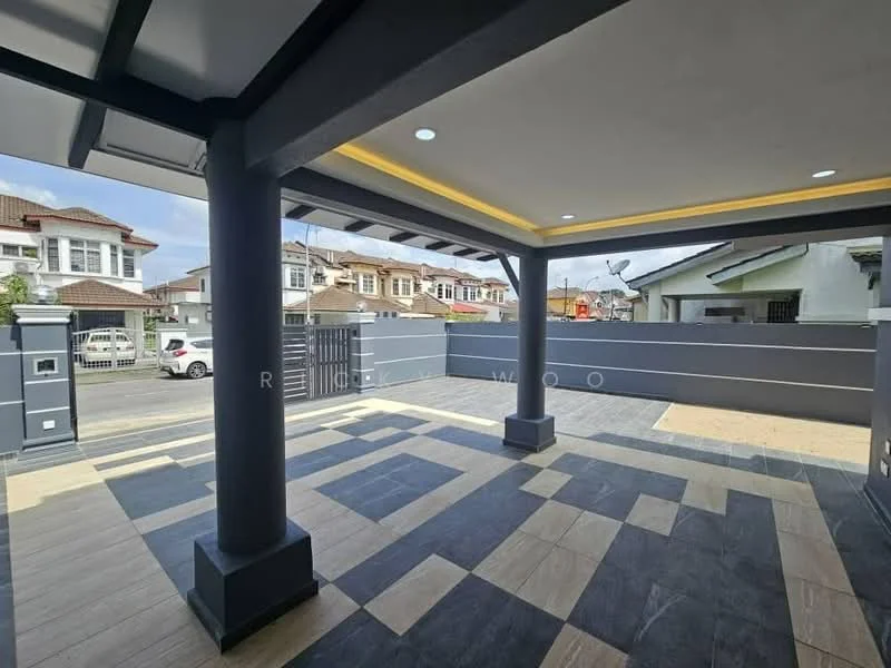 Exterior type: linked terrace house; features: covered porch area, grey painted columns, decorative ceiling with recessed lighting, interlocking stone flooring, combination of light and dark tiles, fenced perimeter, visible street view, manicured landscaping, adjacent residential buildings; style: modern.