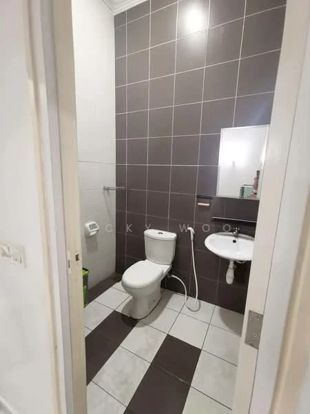 Bathroom features: white toilet, single-sink vanity with mirror, chrome basin mixer, wall-mounted shower head, tile flooring in black and white pattern, grey tiled walls, toilet paper holder, soap dispenser, small waste bin; style: modern.