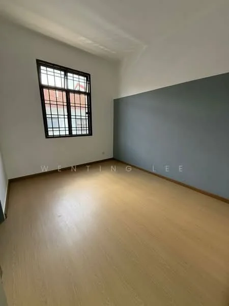 Room features: light wood laminate flooring, white painted walls, grey accent wall, large window with black metal grille, natural light from window; style: minimalist.
