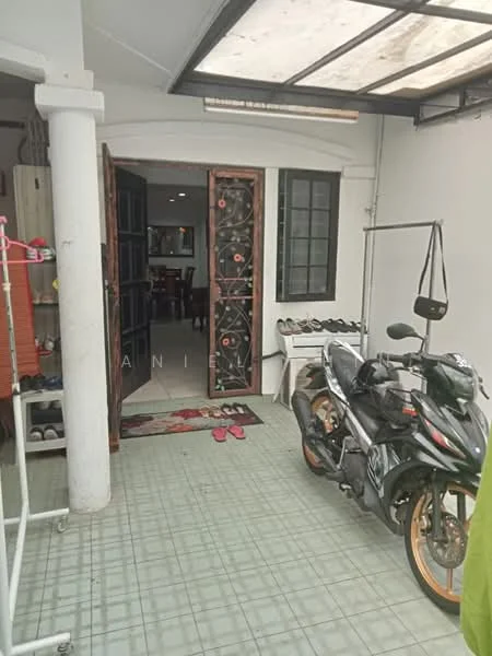 Room features: grey tiled flooring, white walls, double wooden doors with decorative panels, black-framed window, motorcycle parked, shoe rack, door mat, hanging clothes rack; style: modern.