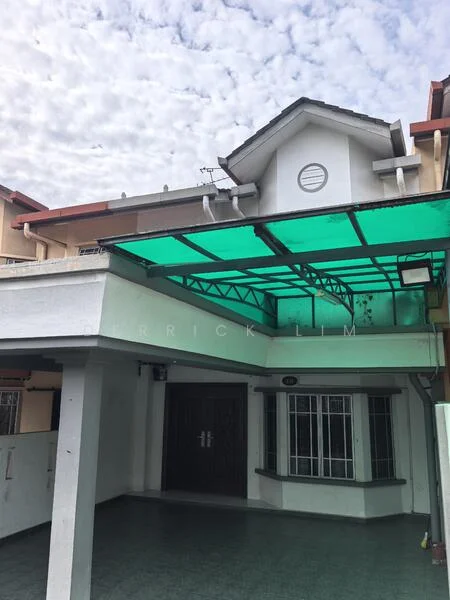 Exterior type: semi-detached house; features: green canopy awning, double main entrance doors, white painted facade, grey tiled roof, front porch area, windows with metal grilles, exposed concrete columns, sliding glass windows, decorative circular vent, manicured front yard; style: modern.