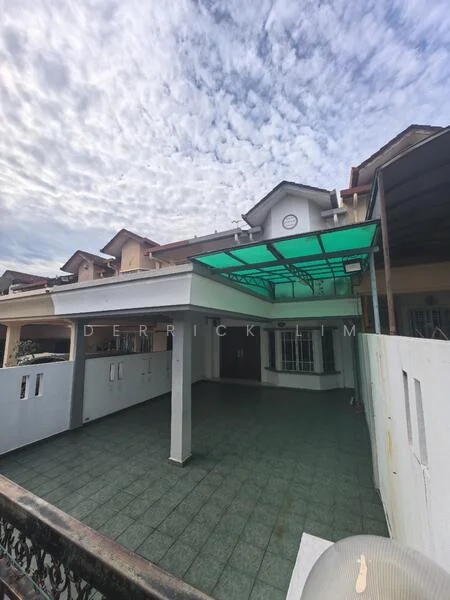 Exterior type: semi-detached house; features: green glass canopy, tiled flooring, white painted walls, front porch area, fenced perimeter, multiple storeys, roof overhang, windows with grills; style: modern.